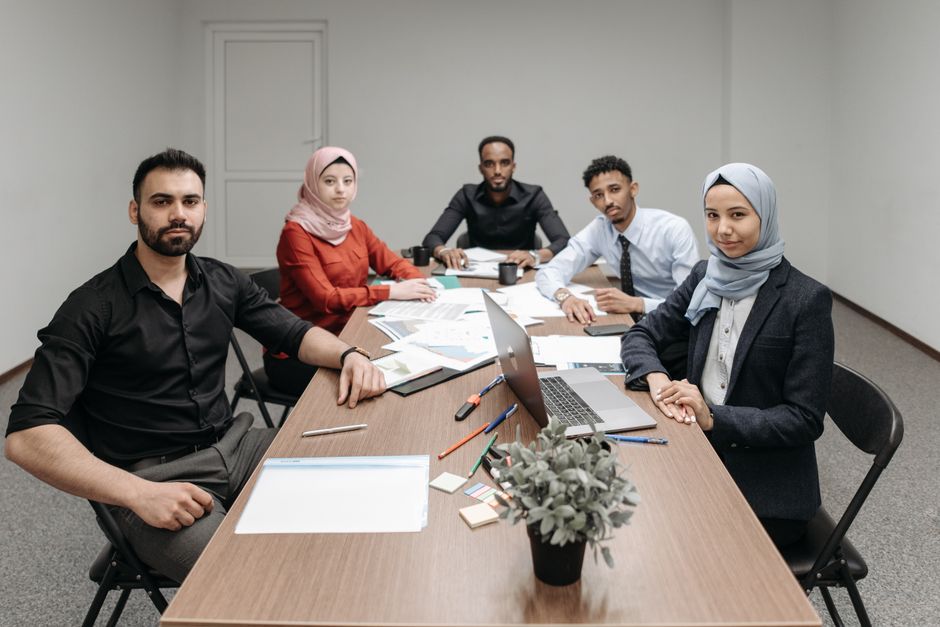 Executive team discussing digital workforce transformation strategies in the Gulf region